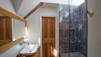 The shared shower-room with its quirky step-up shower is en suite to bedrooms 2 and 3.