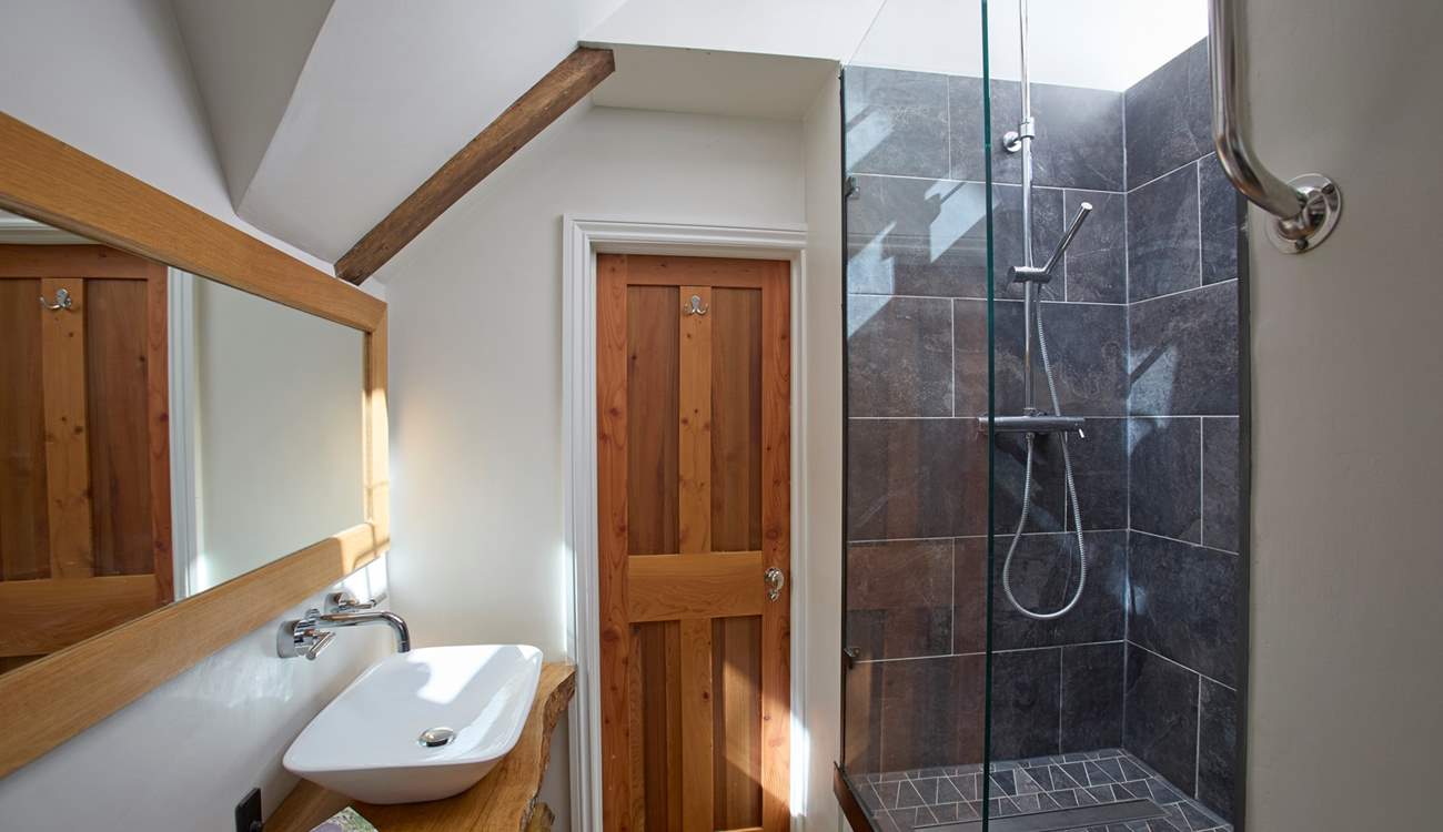 The shower-room, shared with bedrooms 3 and 4, is a light and bright quirky space.