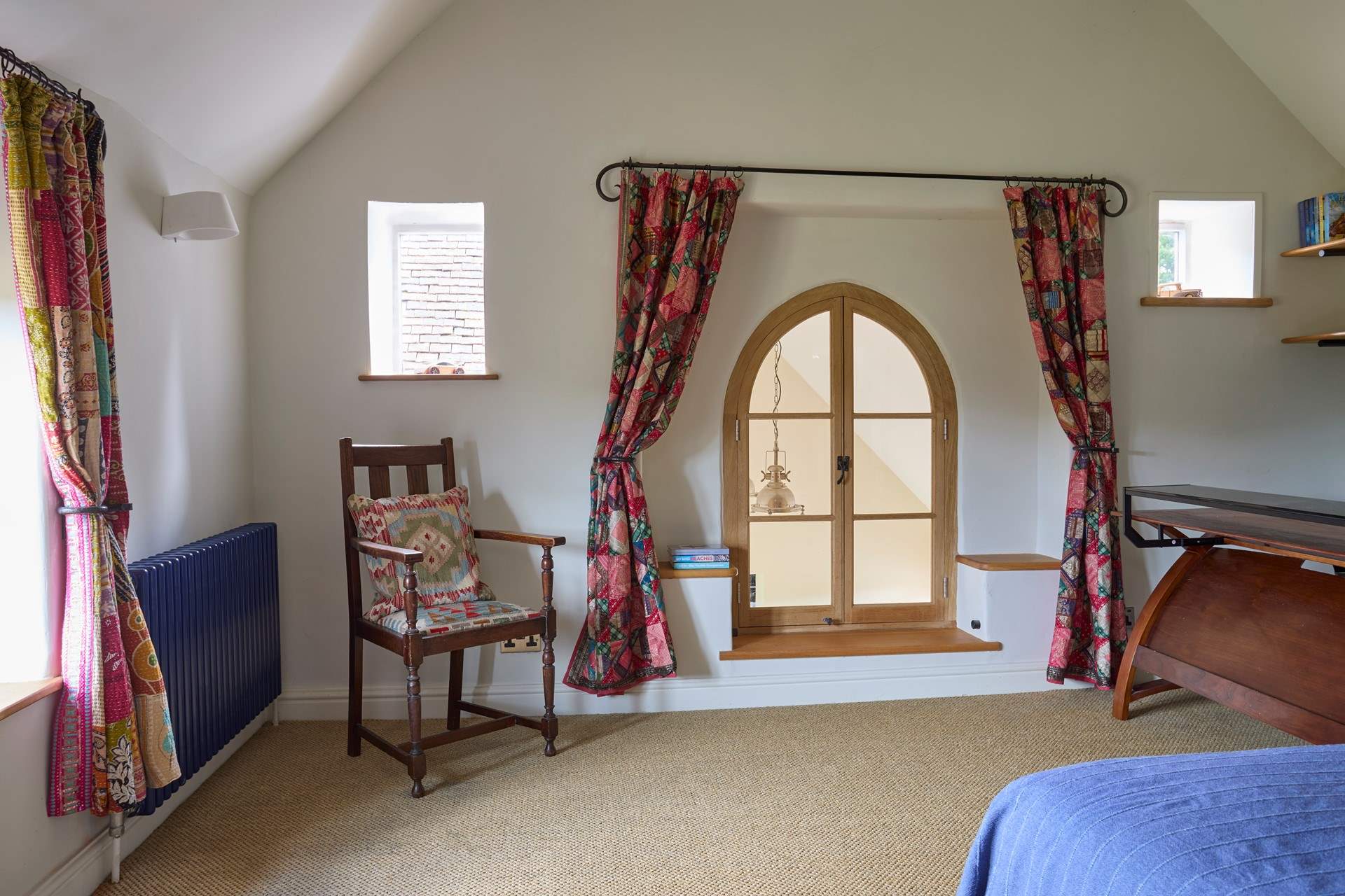 There is a feature window (permanently locked) that looks over the entrance hall and into the open plan kitchen/dining area.