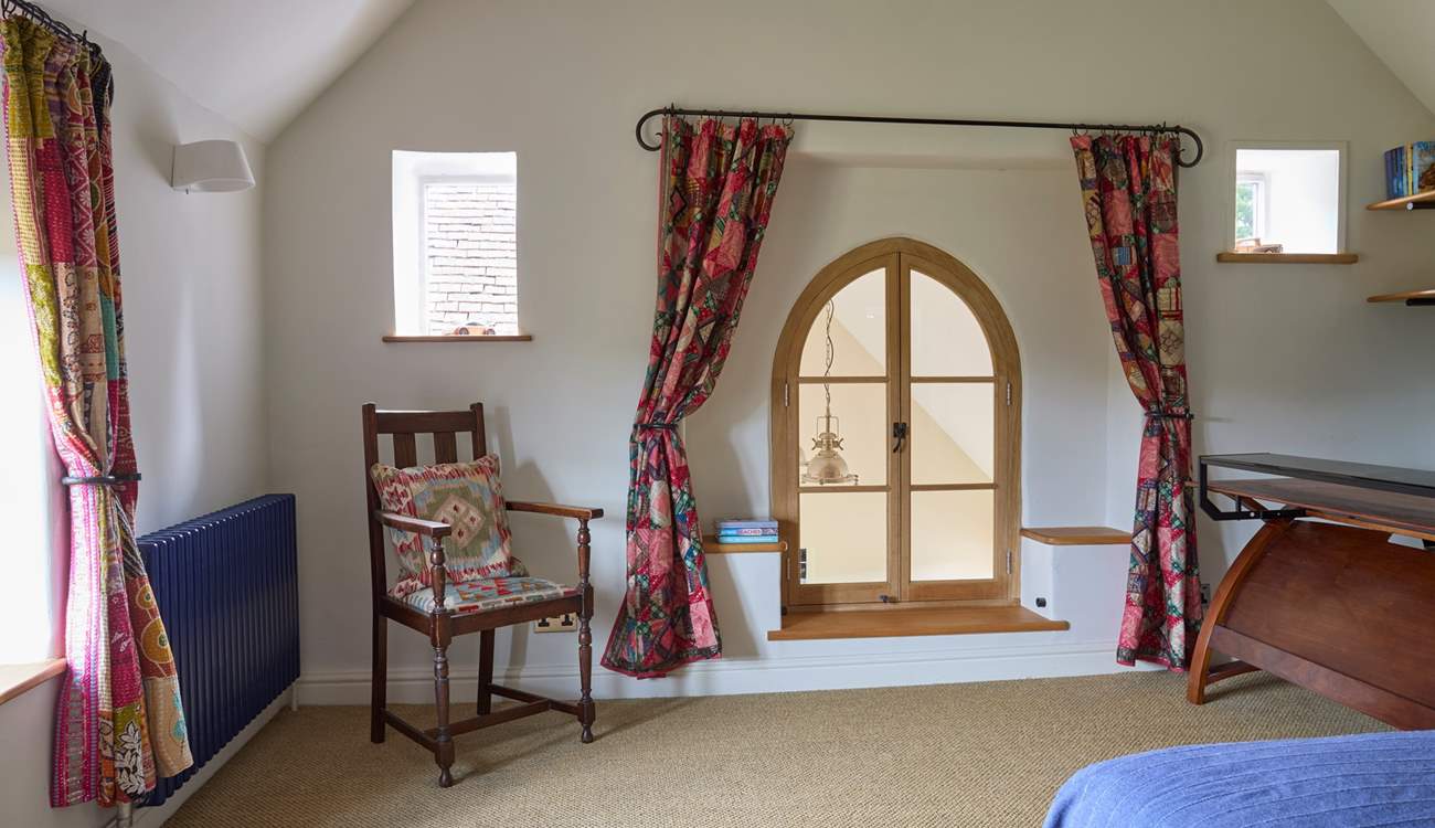 There is a feature window (permanently locked) that looks over the entrance hall and into the open plan kitchen/dining area.