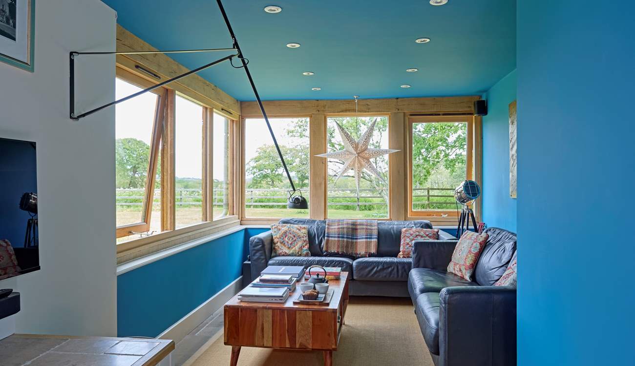 The cosy snug area, with views of the garden and beyond, is a a great spot to sit and watch the wildlife.