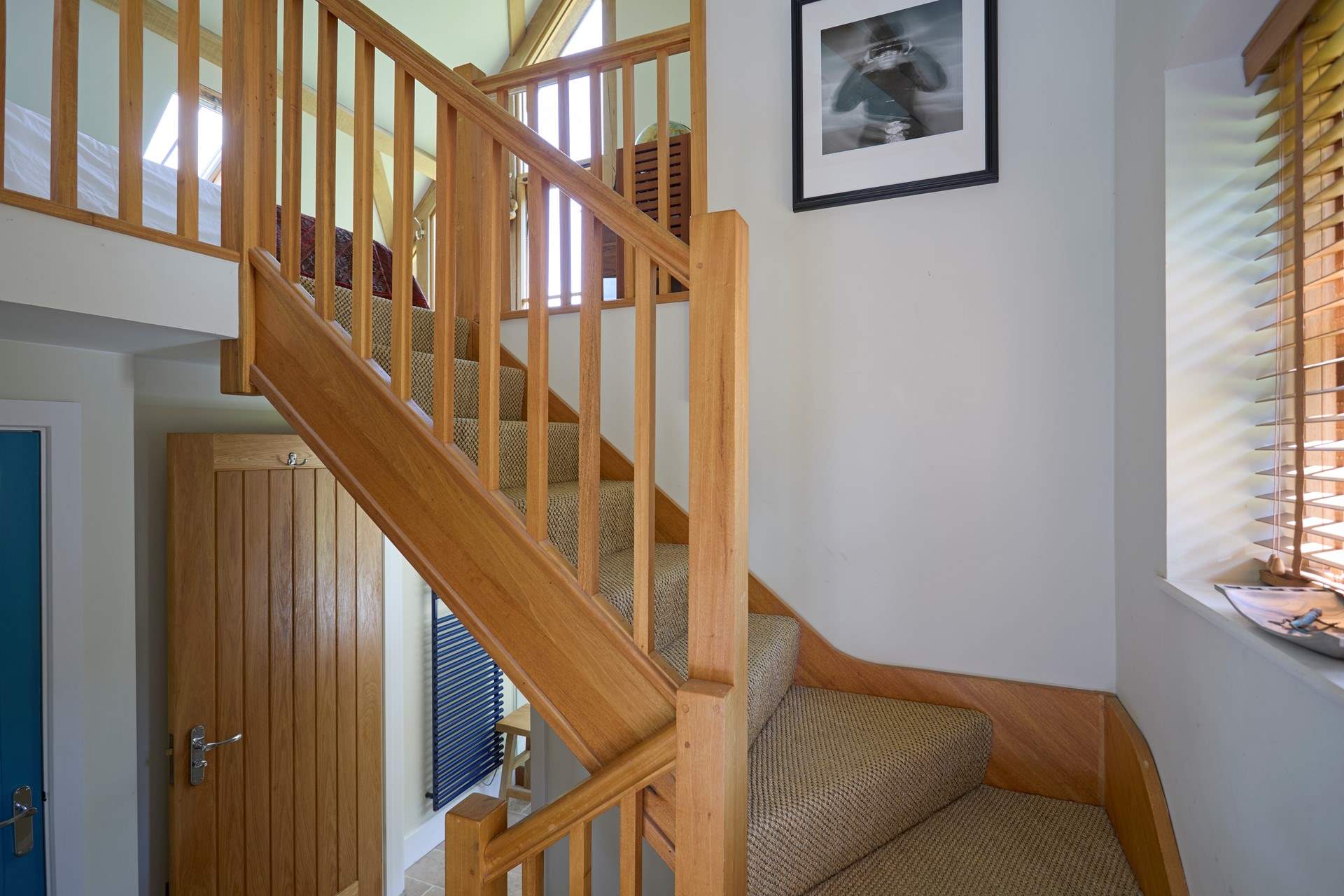 From the kitchen/dining area stairs lead you up to bedroom 1 and down 3 steps to another bathroom.