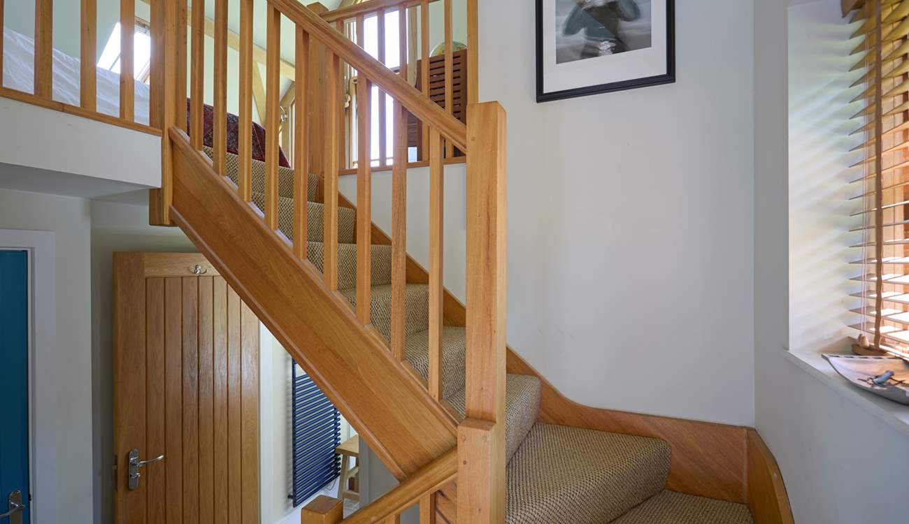 From the kitchen/dining area stairs lead you up to bedroom 1 and down 3 steps to another bathroom.