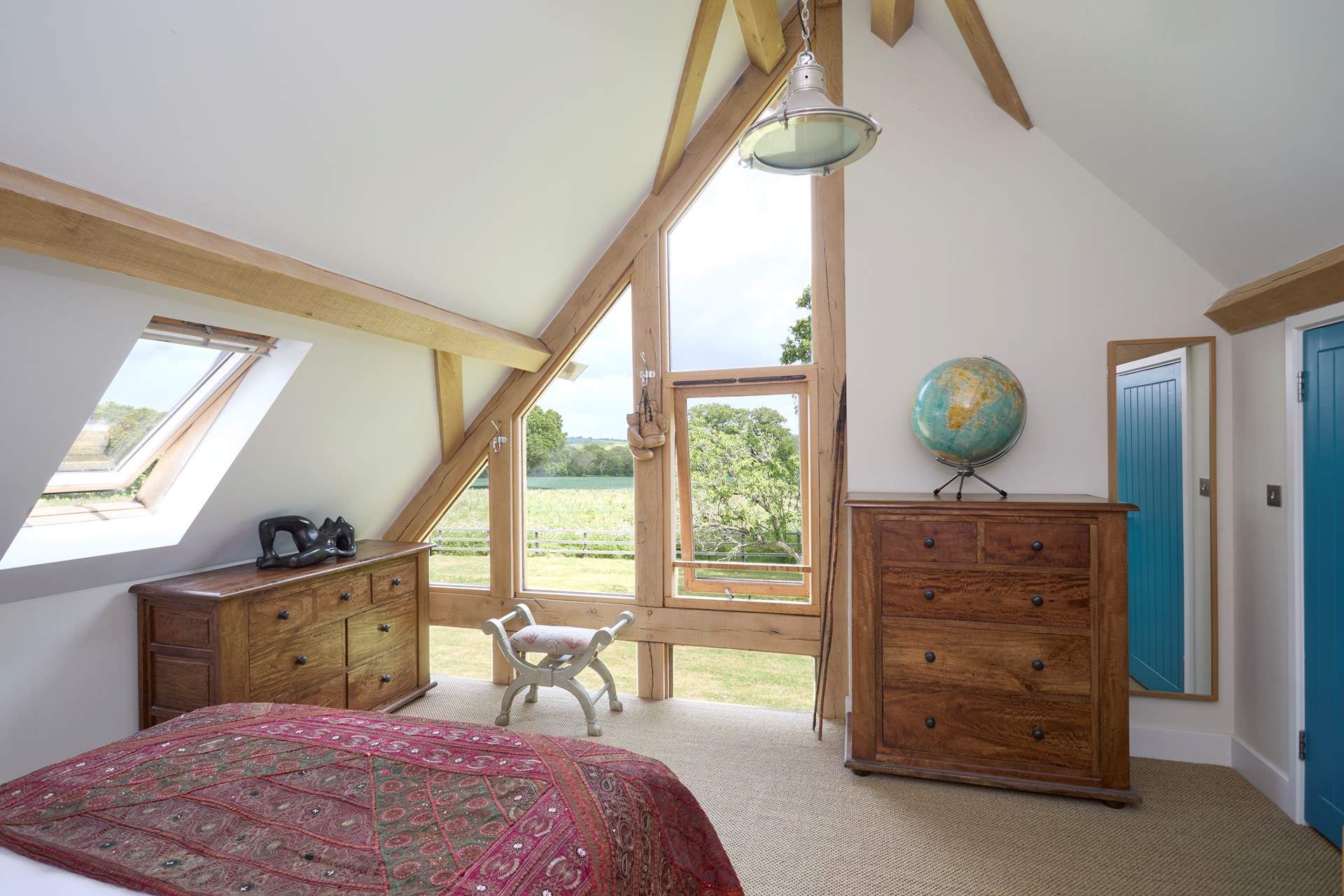 With floor to ceiling windows and no curtains or blinds, you will wake to a beautiful view of the garden.