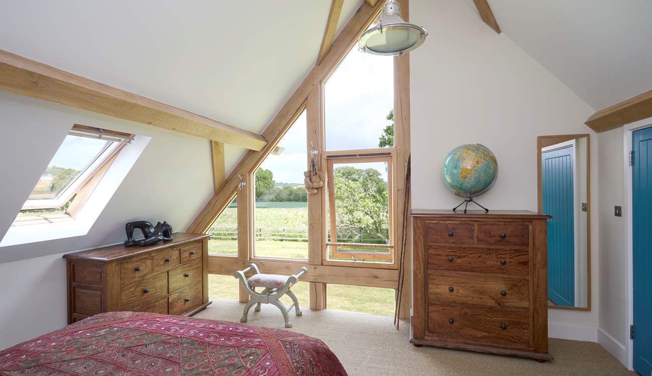 With floor to ceiling windows and no curtains or blinds, you will wake to a beautiful view of the garden.