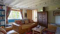 Relax in the cosy sitting-room.