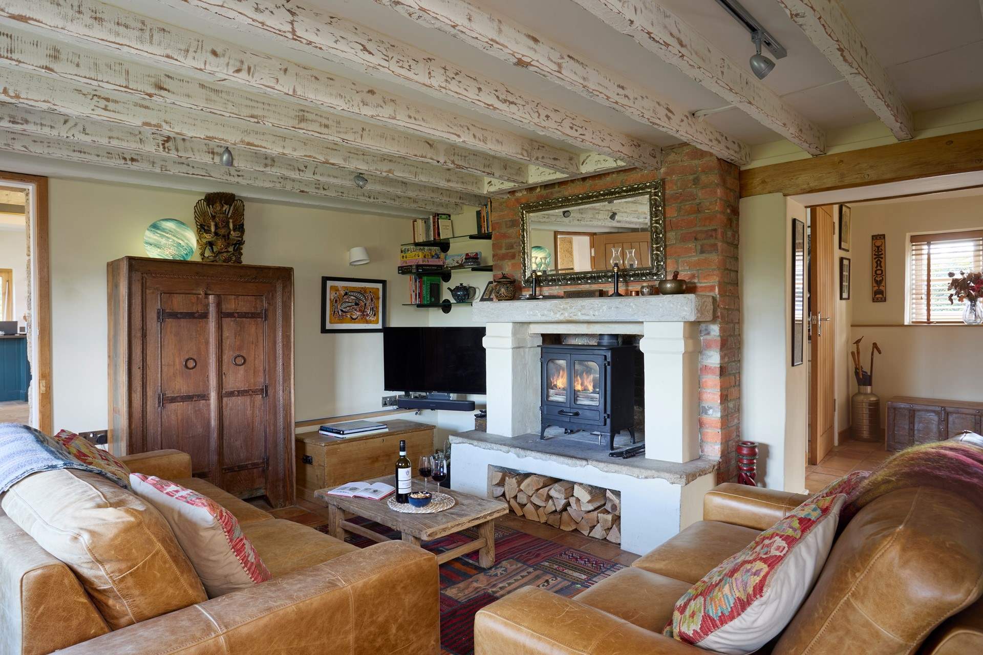 The beautiful sitting-room with large wood-burner for those cooler evenings.
