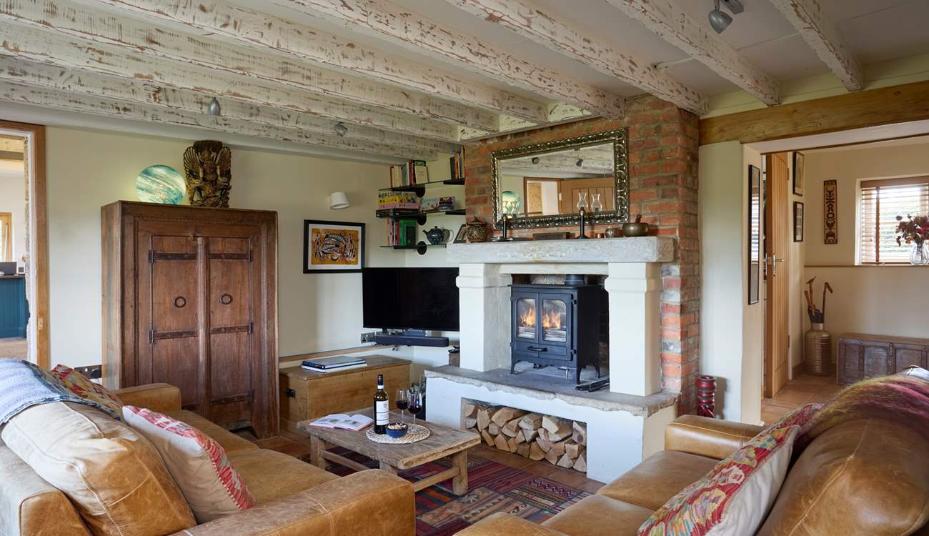 The beautiful sitting-room with large wood-burner for those cooler evenings.