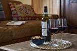 Sink into the sofa with a good book and a glass of wine.