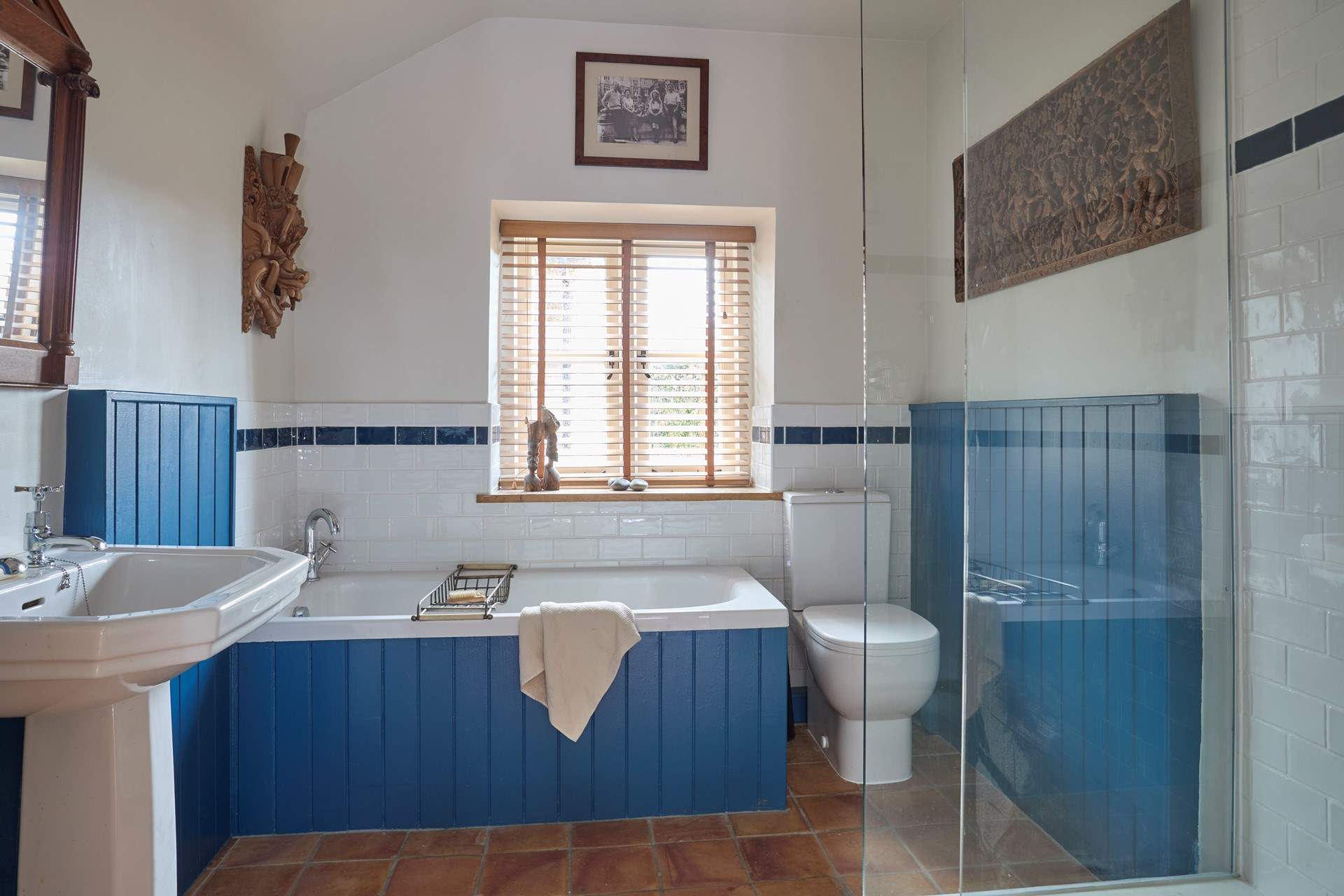 Ground floor bathroom with bath and separate shower.
