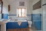 Ground floor bathroom with bath and separate shower.