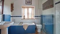 Ground floor bathroom with bath and separate shower.