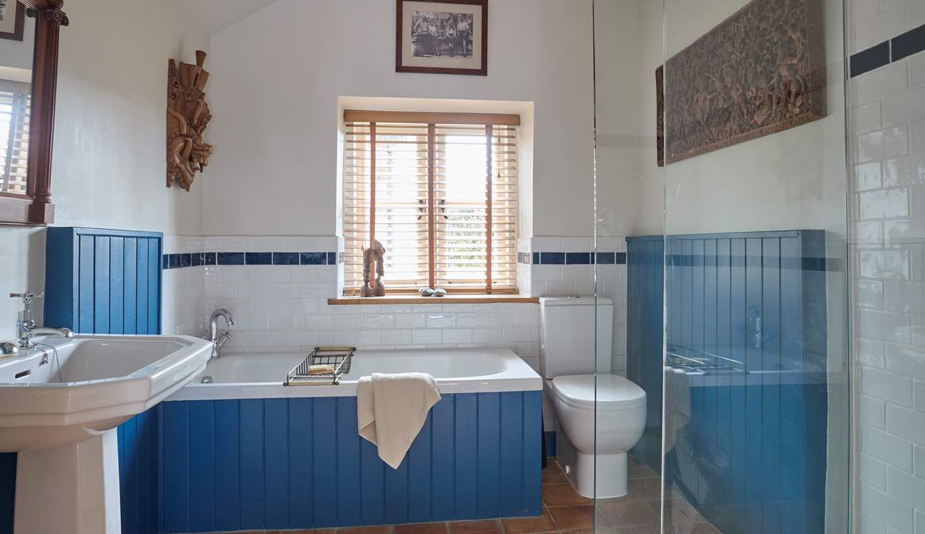 Ground floor bathroom with bath and separate shower.