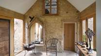 The splendid entrance hall connects the lodge house to the gamekeeper’s cottage