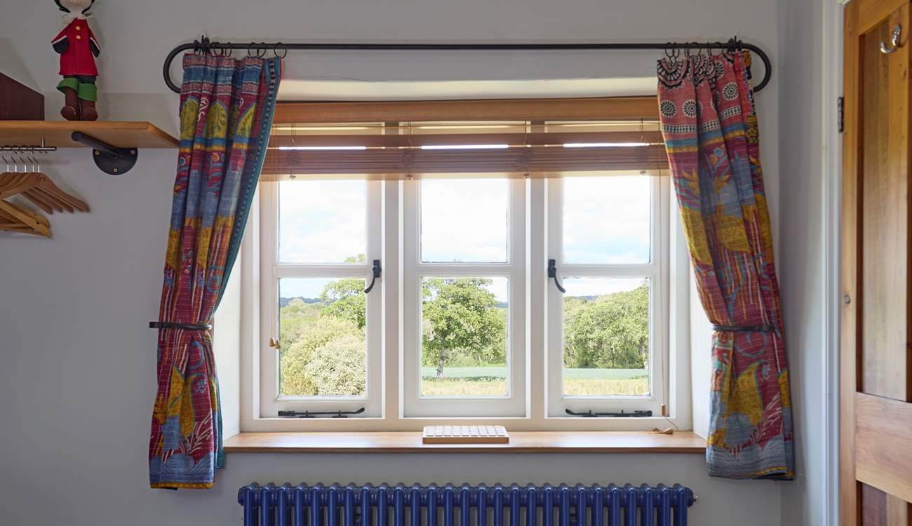 With pretty views over the garden and beyond.
