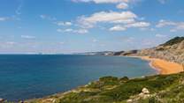 Looking towards Compton Bay. This magnificent coastline often has perfect conditions for surfers and paragliders, and the miles of beach are perfect for dog walkers.