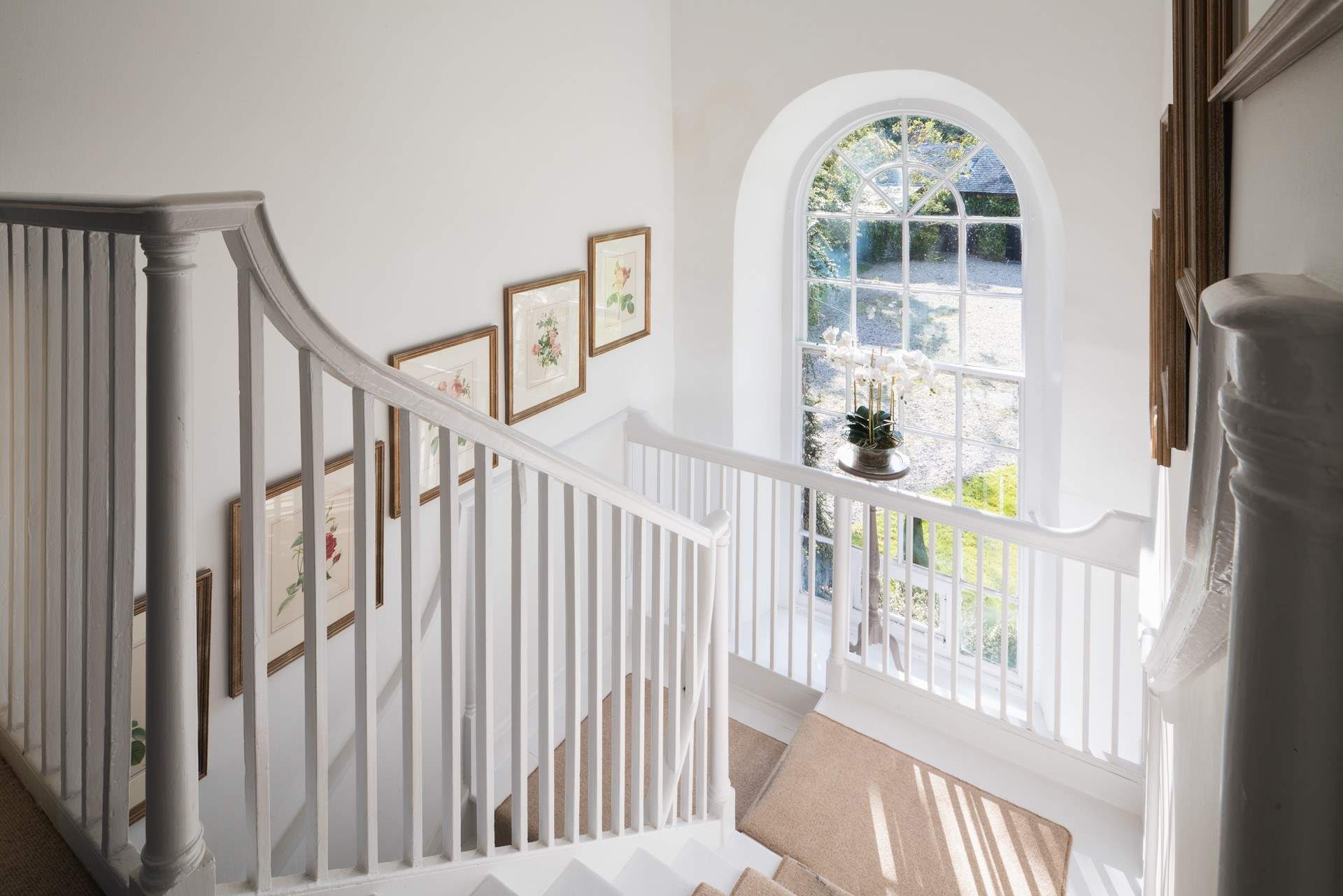The light streams in through the large arched window.