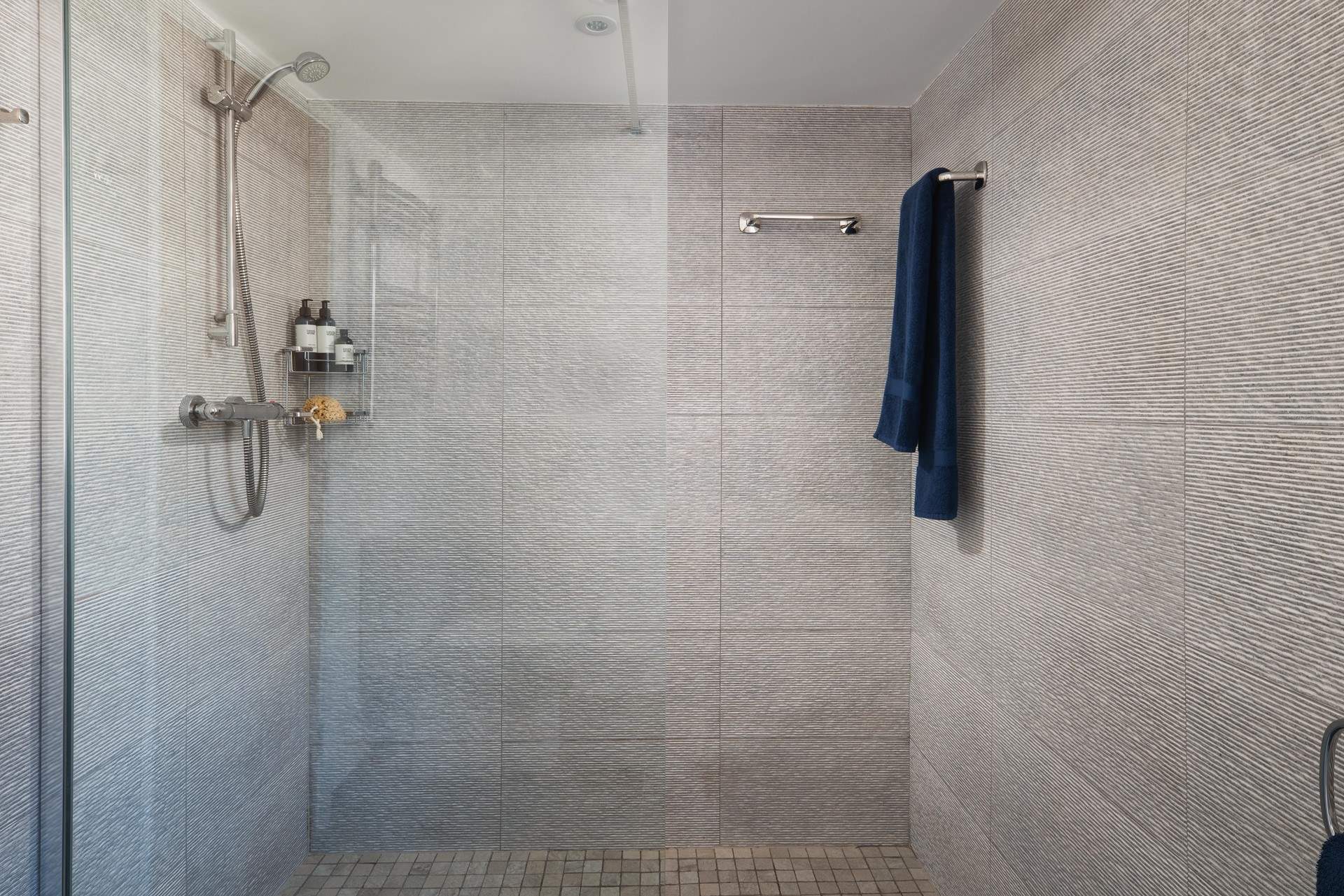 There's a large walk-in shower in the shower-room on the ground floor.