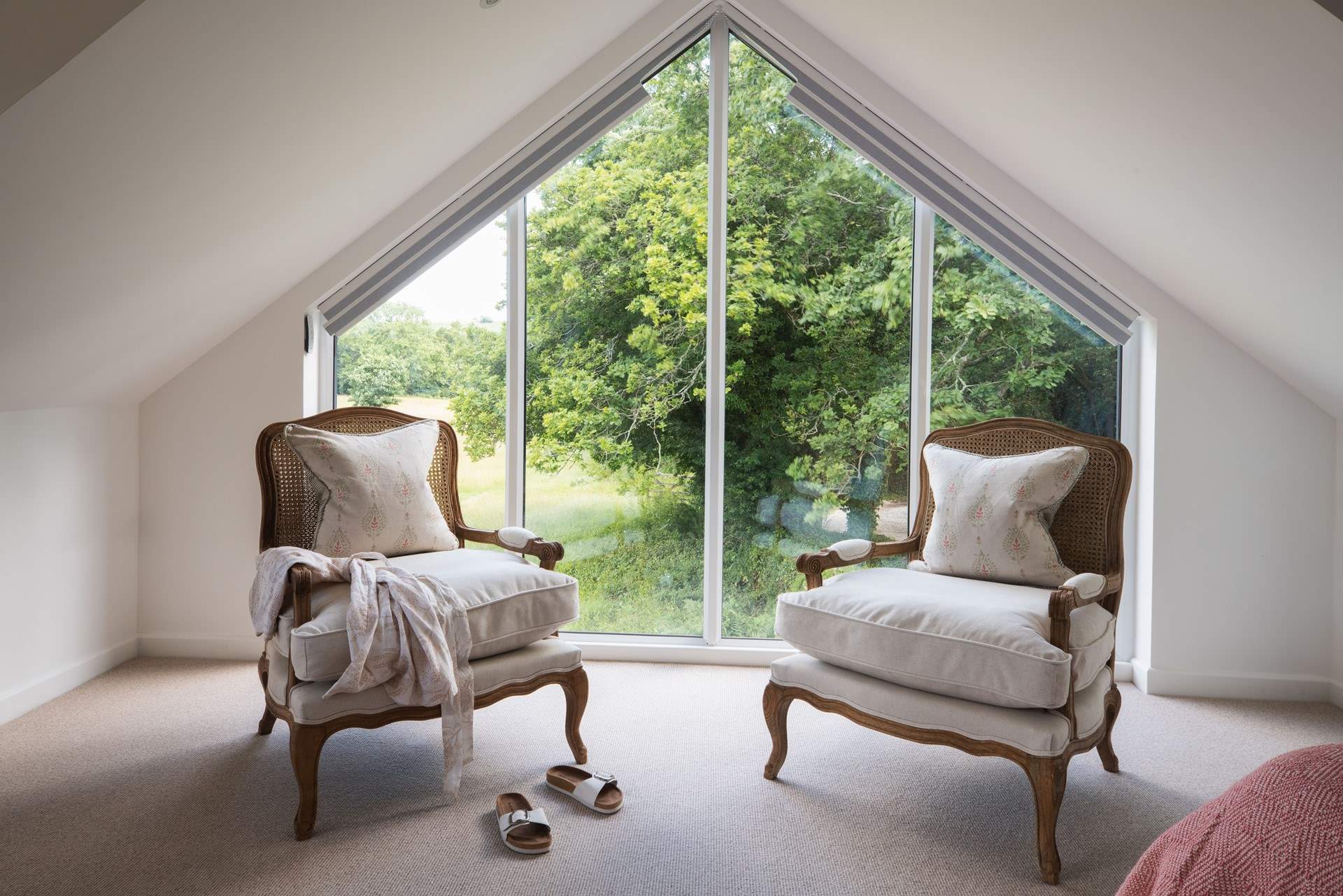 Bedroom 1 offers a super-king size bed, vaulted ceiling and a large picture window that perfectly frames the view.