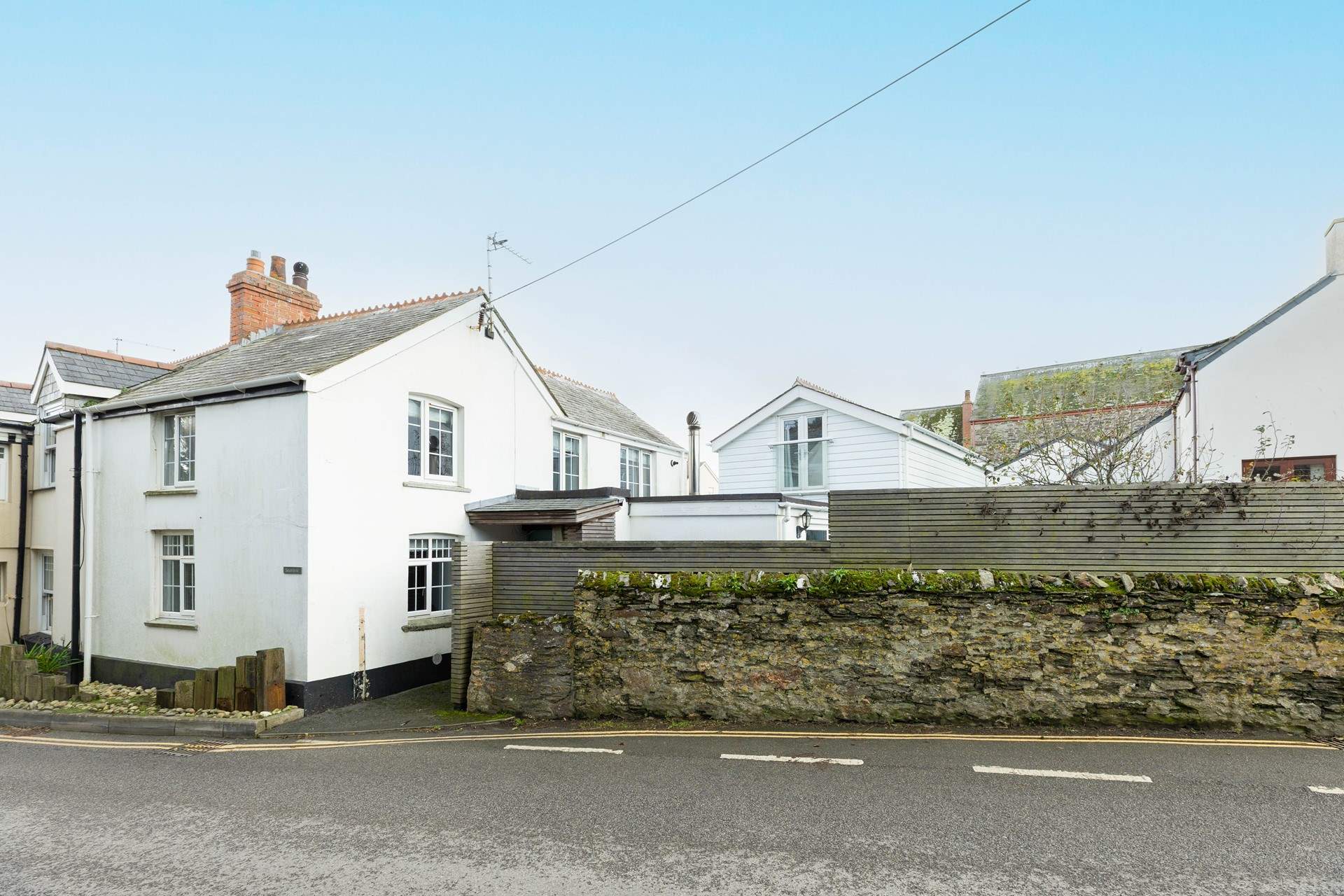 Seaview Cottage is tucked behind the garden wall. 