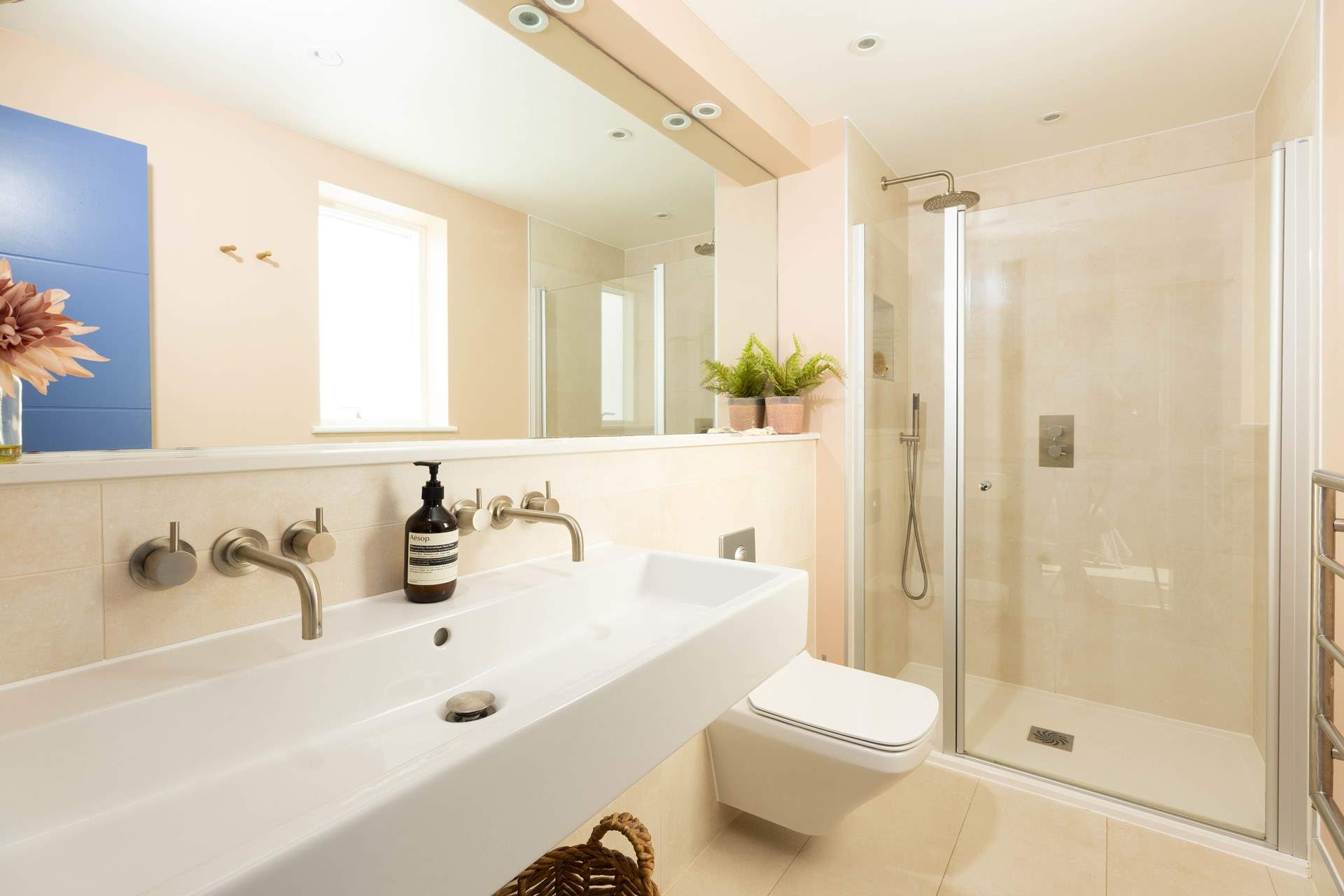 The en suite shower-room has luxurious double sinks. 