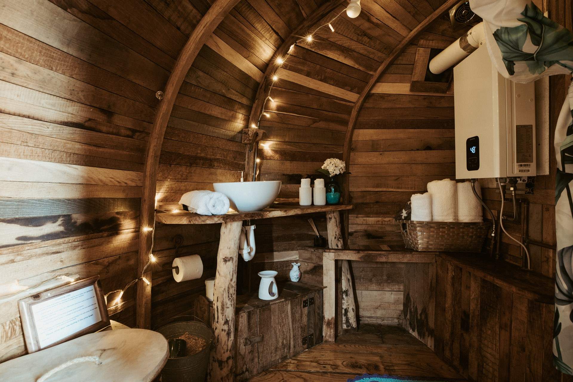Just beyond the kitchen, you’ll find the curved shower-room with compostable toilet.