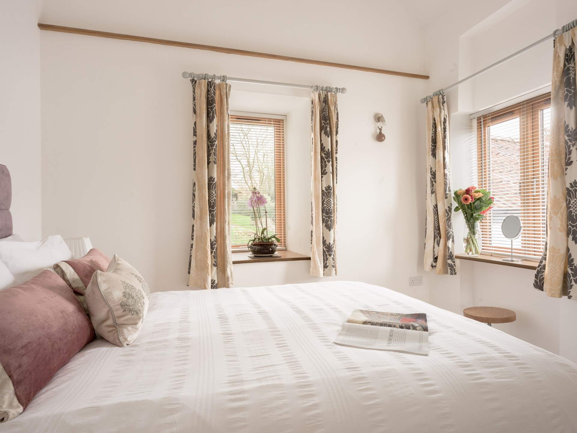 The bedroom with its dual-aspect, sumptuous king-size bed and vaulted ceiling is the most wonderful place to lay your head. You will sleep well here...