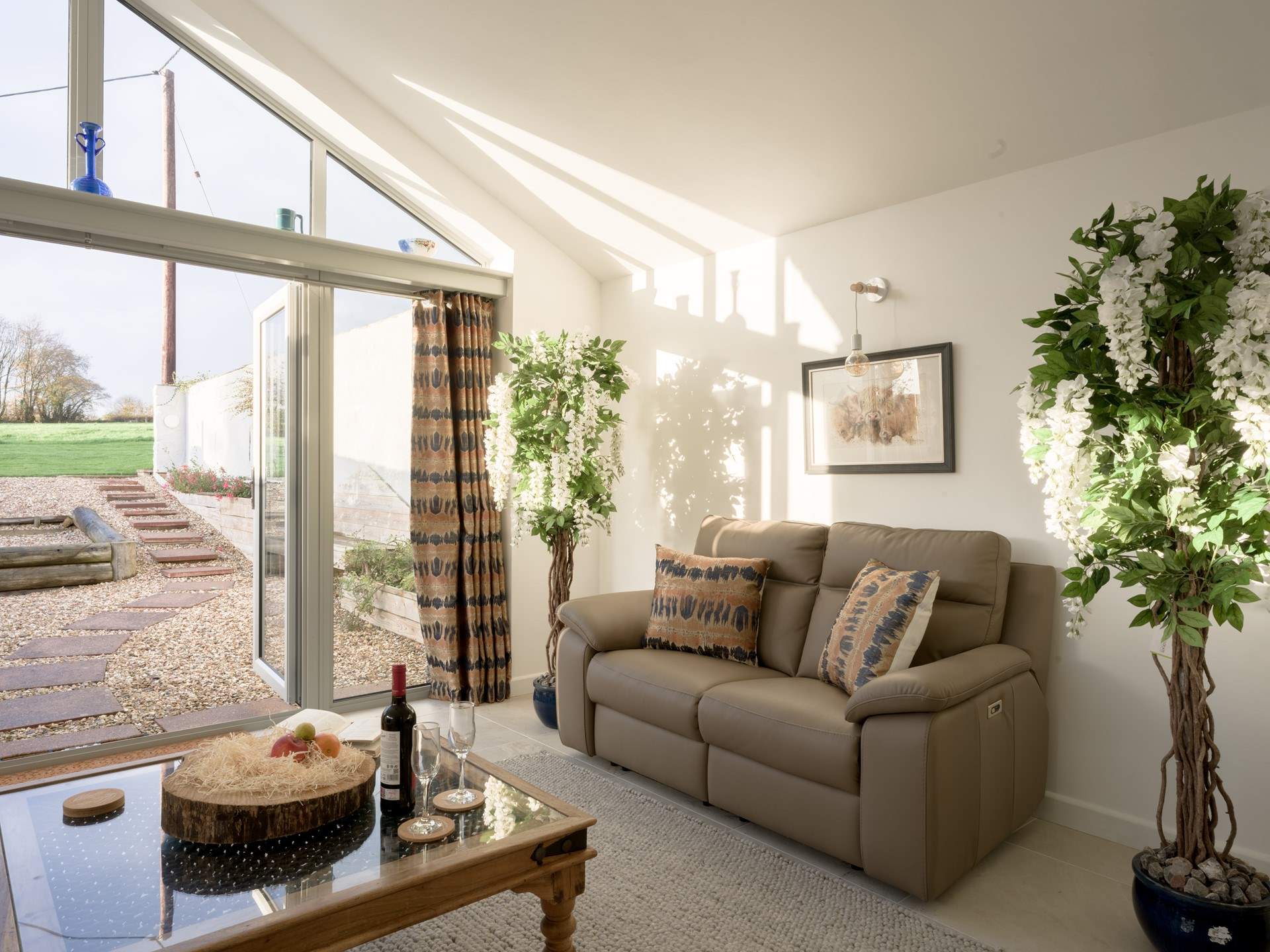 As the sun slowly sets the reclining sofa is a favourite spot to while away a few hours with a good book and a glass of something nice.