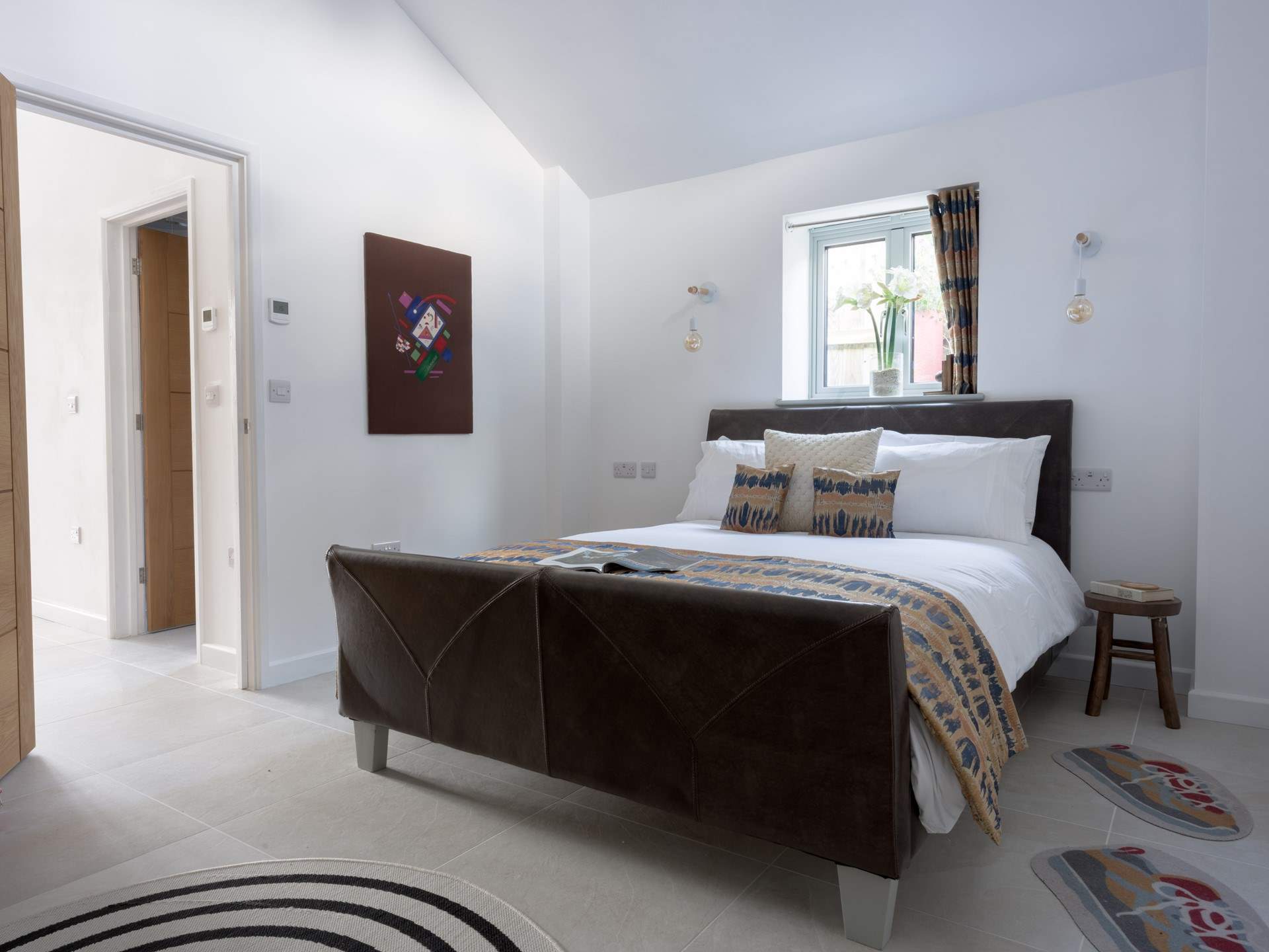 Deceptively spacious throughout with simple, pared back interiors making for a serene and blissful place to be.