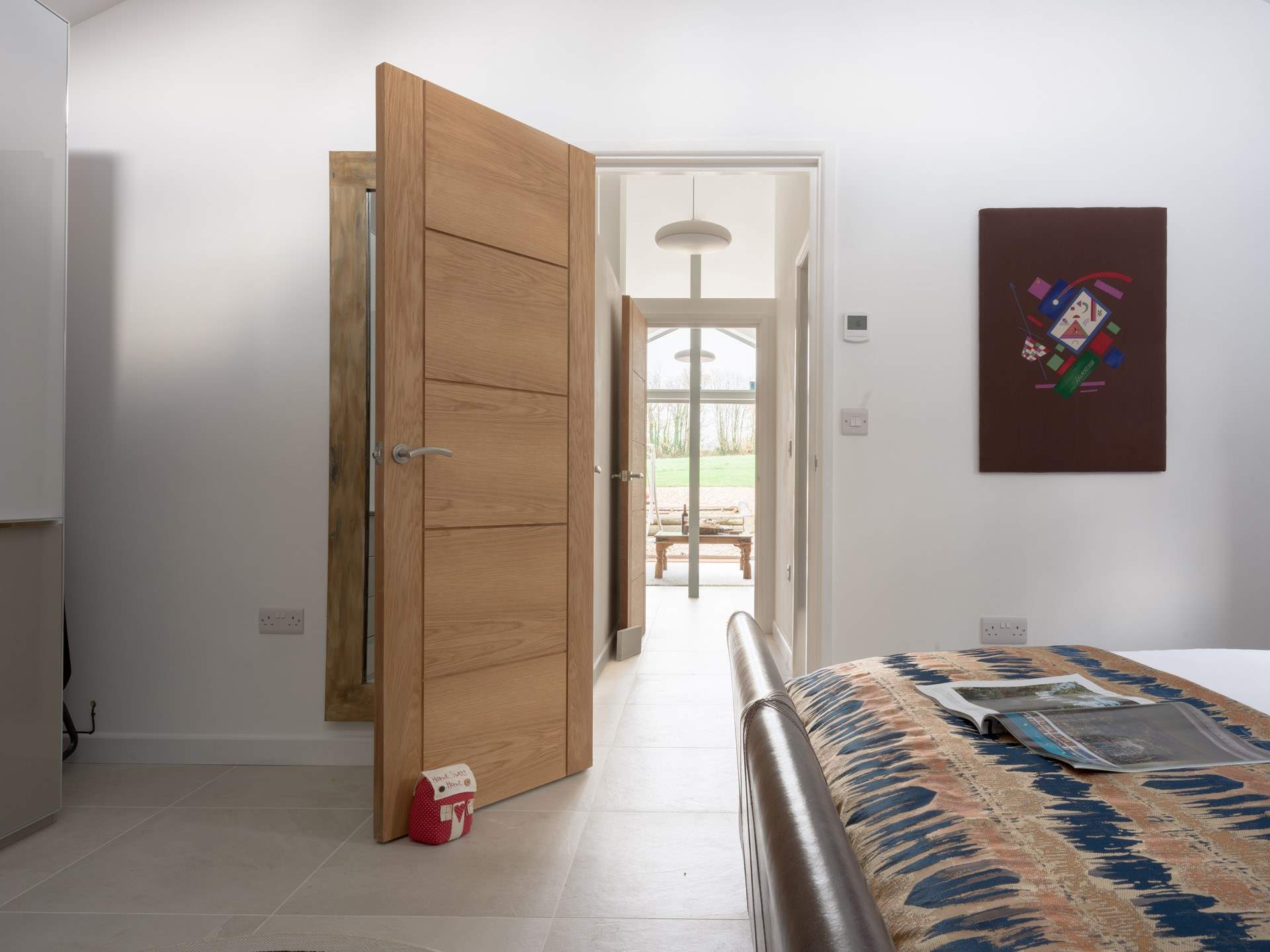 Just down the hallway from the living area is the main bedroom with a glorious king-size bed, double height ceiling and lots of storage. It is pin drop silent so be prepared for a few lie ins...