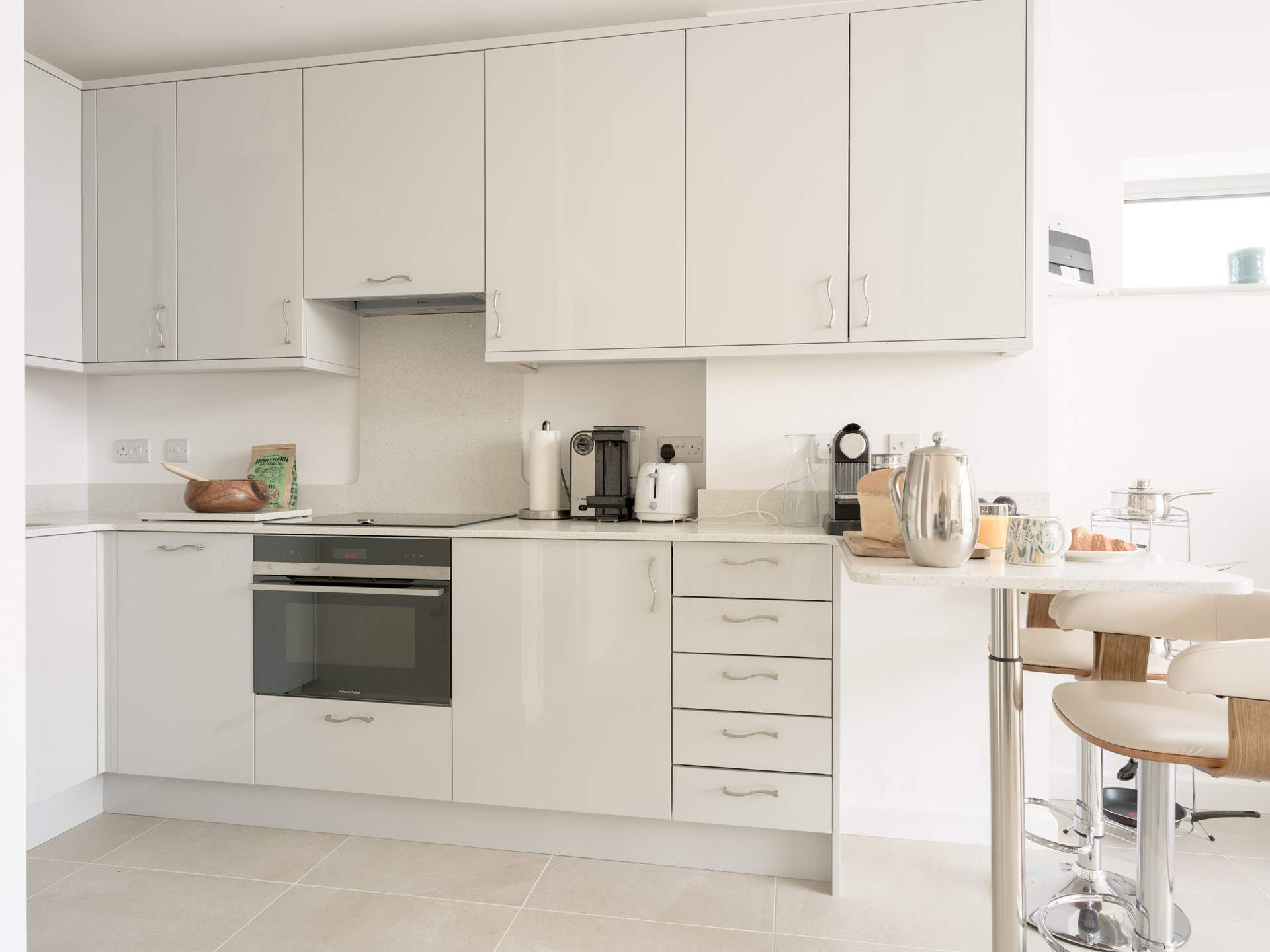 The kitchen-area showcases some high end luxury with all the fixtures you would expect to find as well as a coffee machine and smart little breakfast-bar for that all-important spot of brunch after a well deserved lazy start.