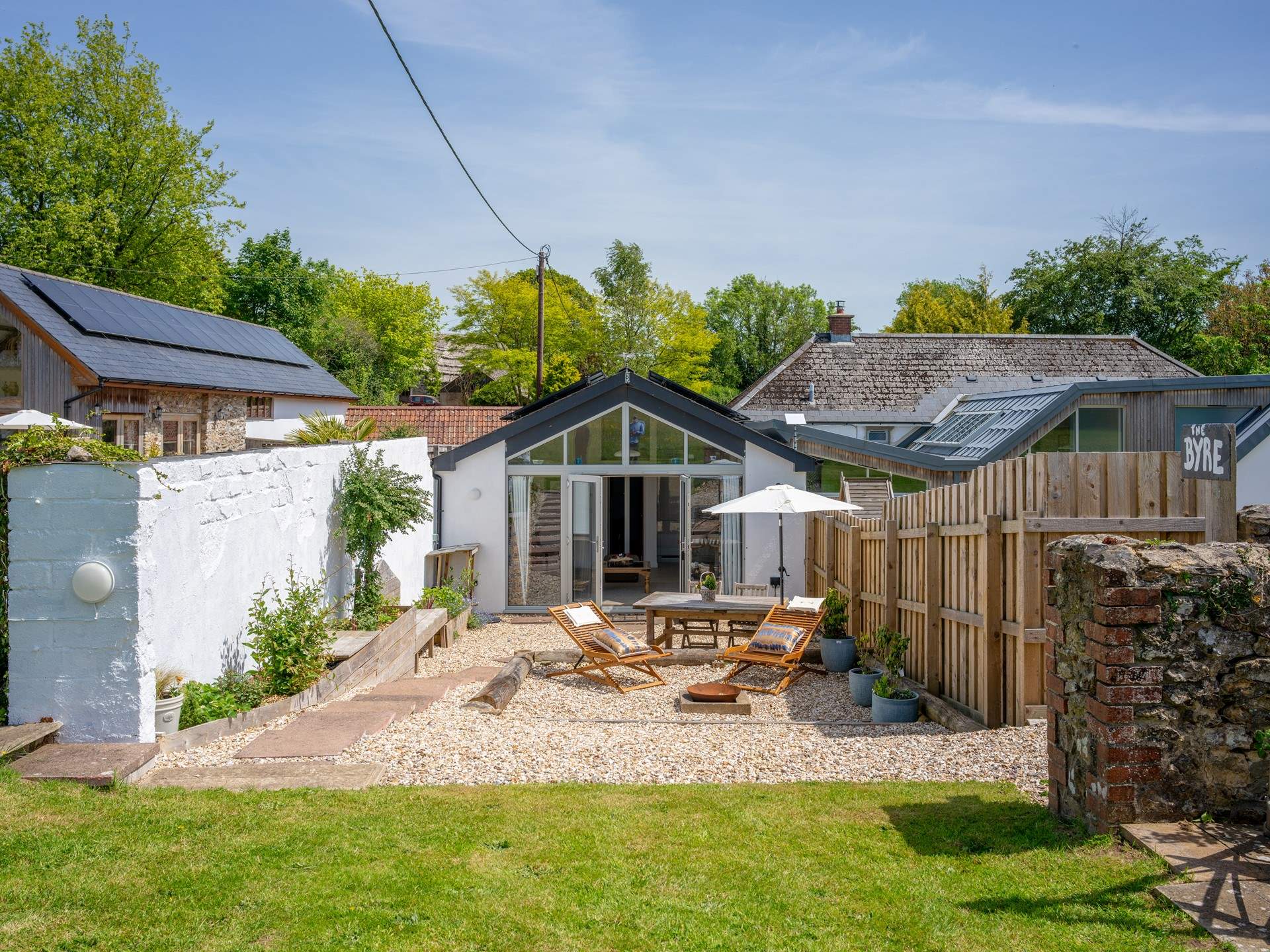 The Byre has lovely dedicated outdoor space with seating, a fire-pit and sun-loungers. It's also the perfect spot to watch the sun go down over the paddock. The parking-area is just off to the left next to the games barn.