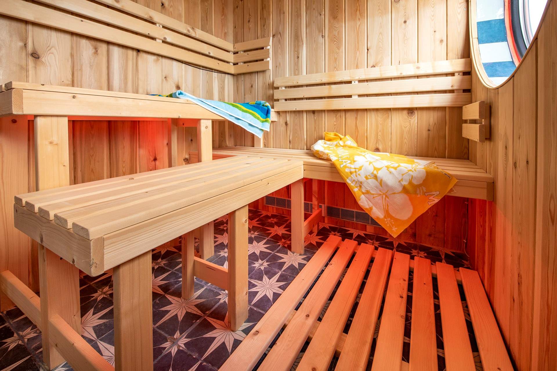 From the sauna in the shared spa, you can still enjoy the view out to sea. 