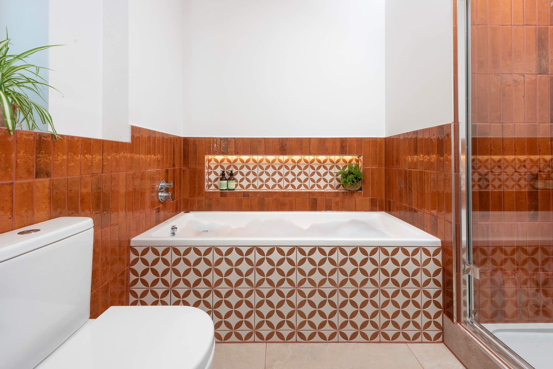 There's a family bathroom on the ground floor, offering a bath for those who love a leisurely soak as well as....