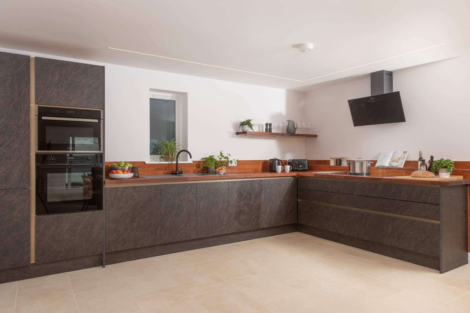 The super stylish kitchen is so well-equipped with all your need to cook up a feast.