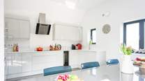 The kitchen is fully equipped with that all-important wine fridge! 