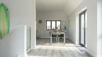 Head upstairs to the open plan living area and out on to the terrace.