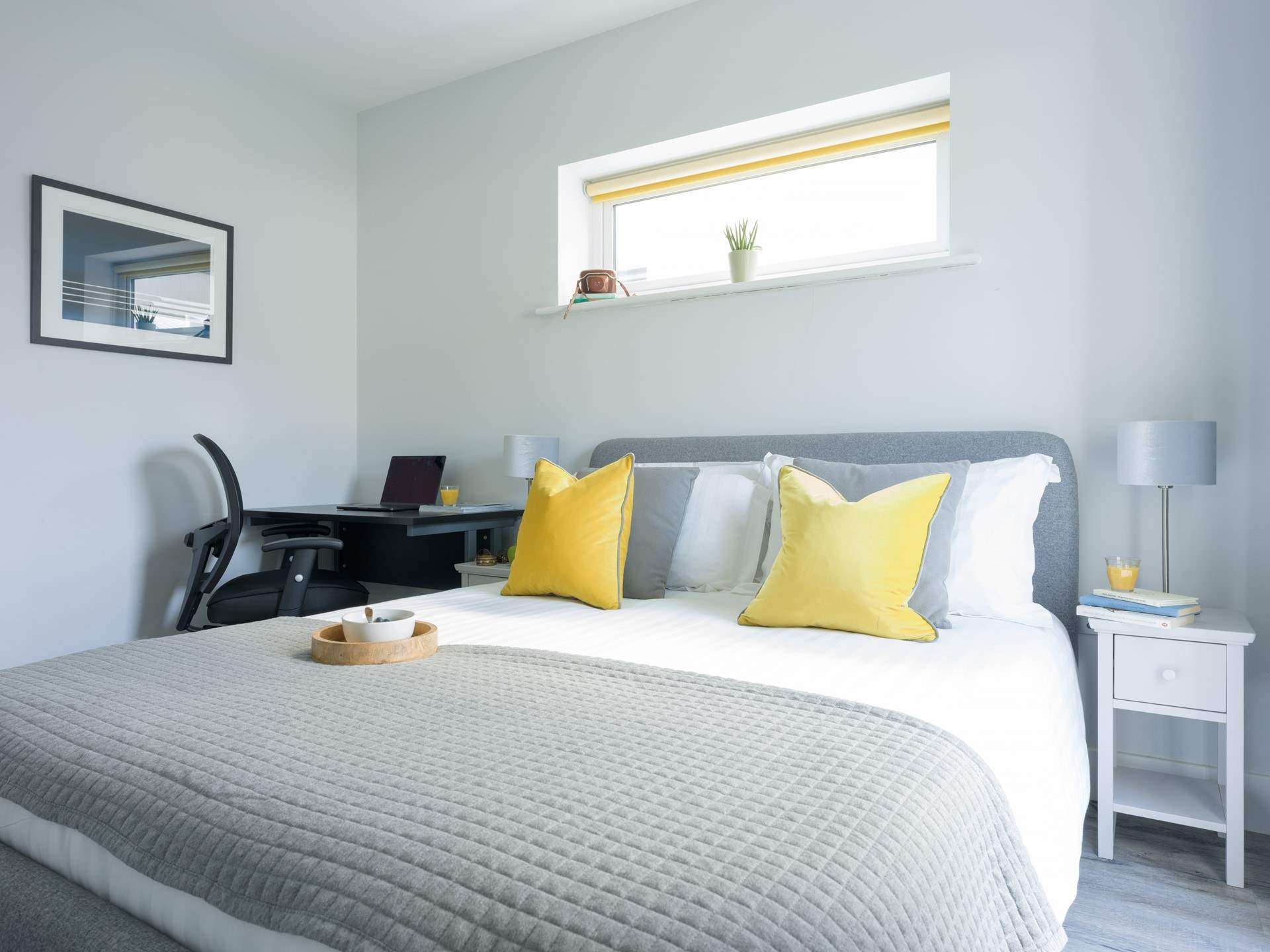 Bedroom 1 has an en suite shower-room, a space to work and a comfortable bed.