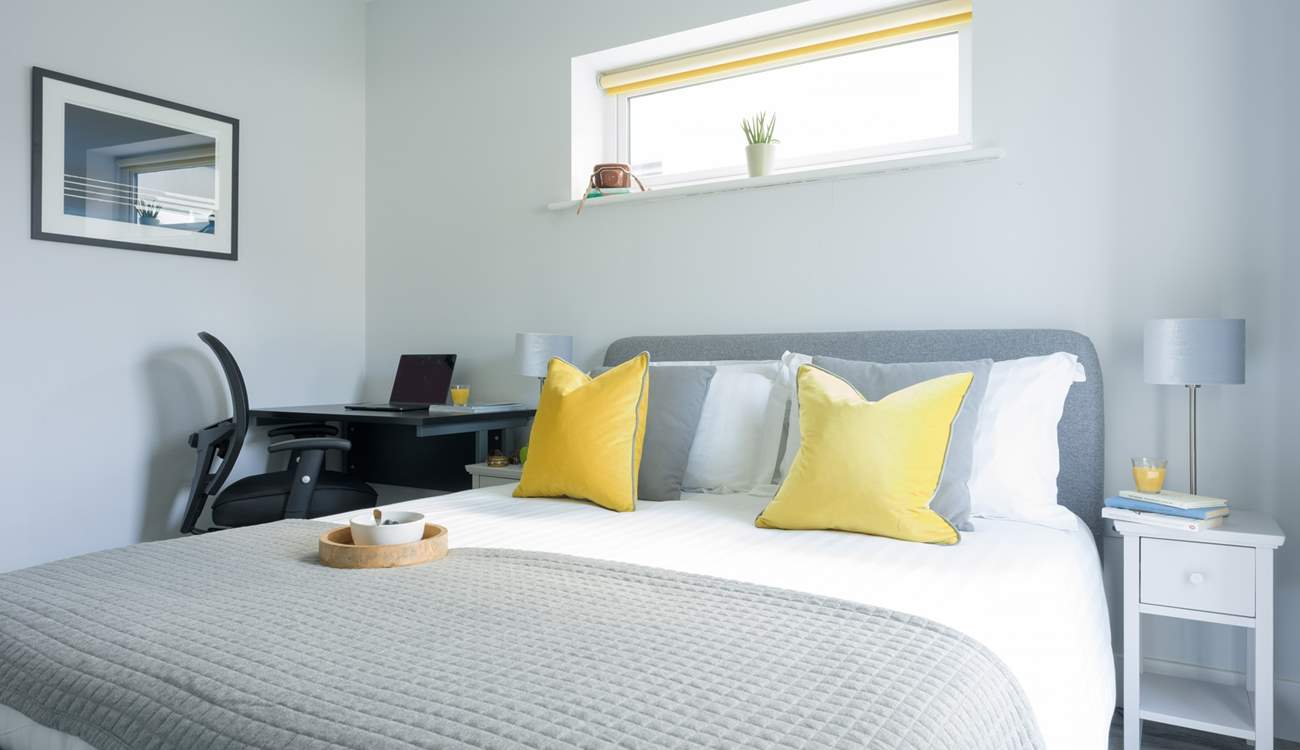 Bedroom 1 has an en suite shower-room, a space to work and a comfortable bed.