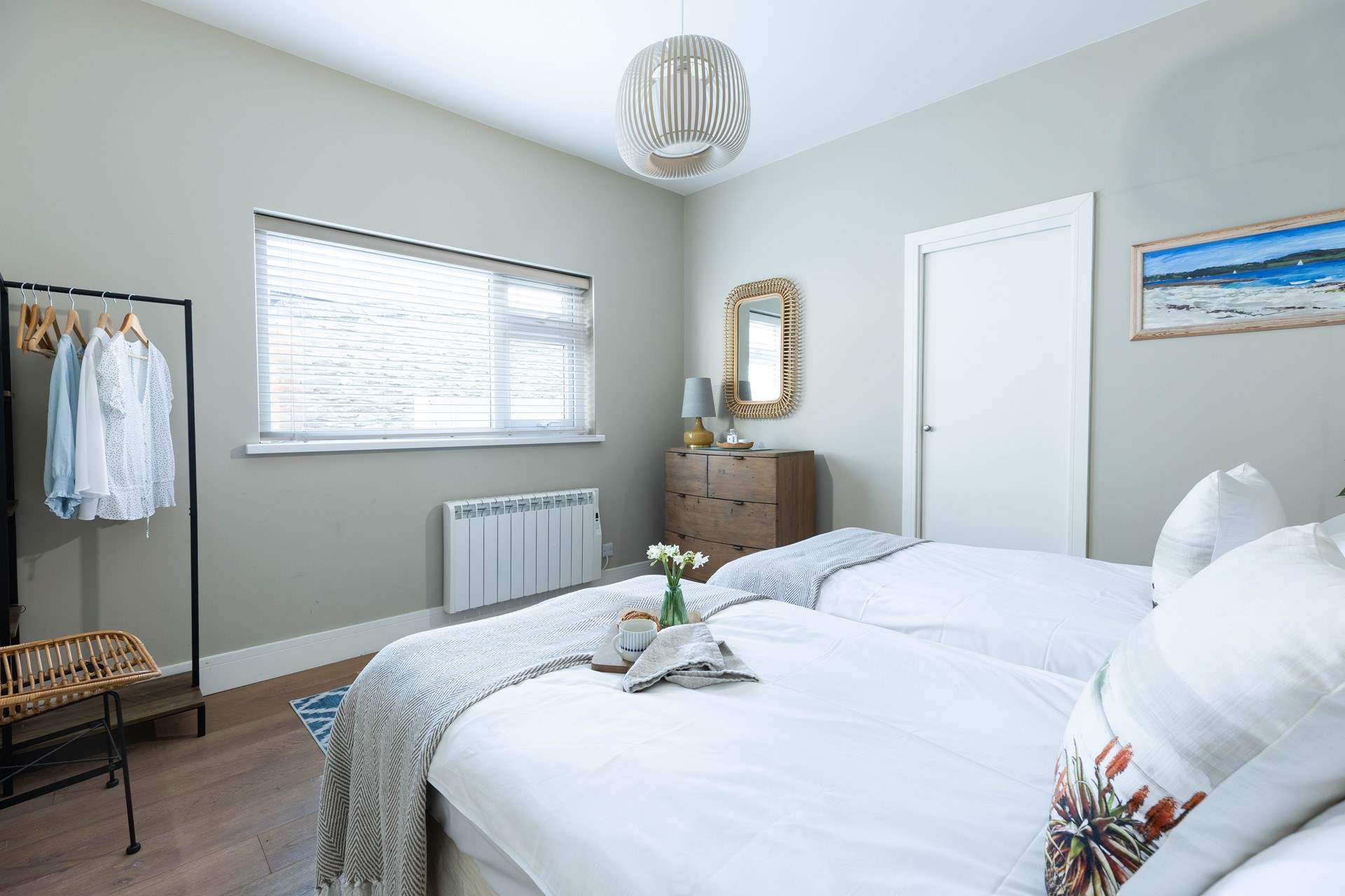 Neutral tones for a restful night in the twin bedroom.