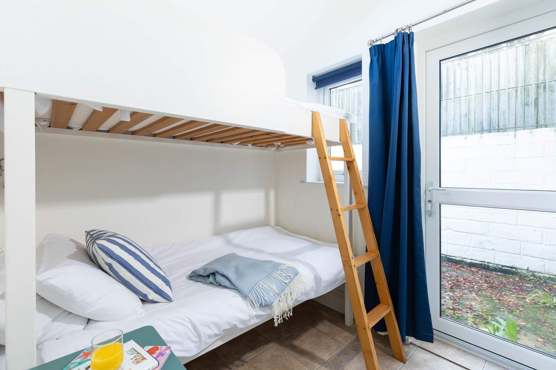 Children will love the bunk-beds in bedroom 2. Please note the bedrooms are on the ground floor and this room has a door leading outside. 