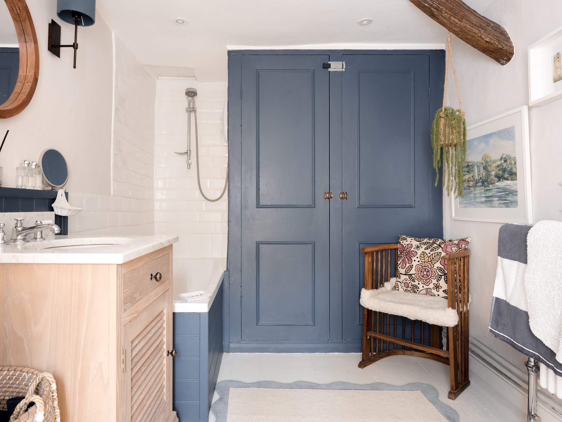 The extra large family bathroom showcases lots of natural light and  is perfect for a long soak or an energising blast in the shower.