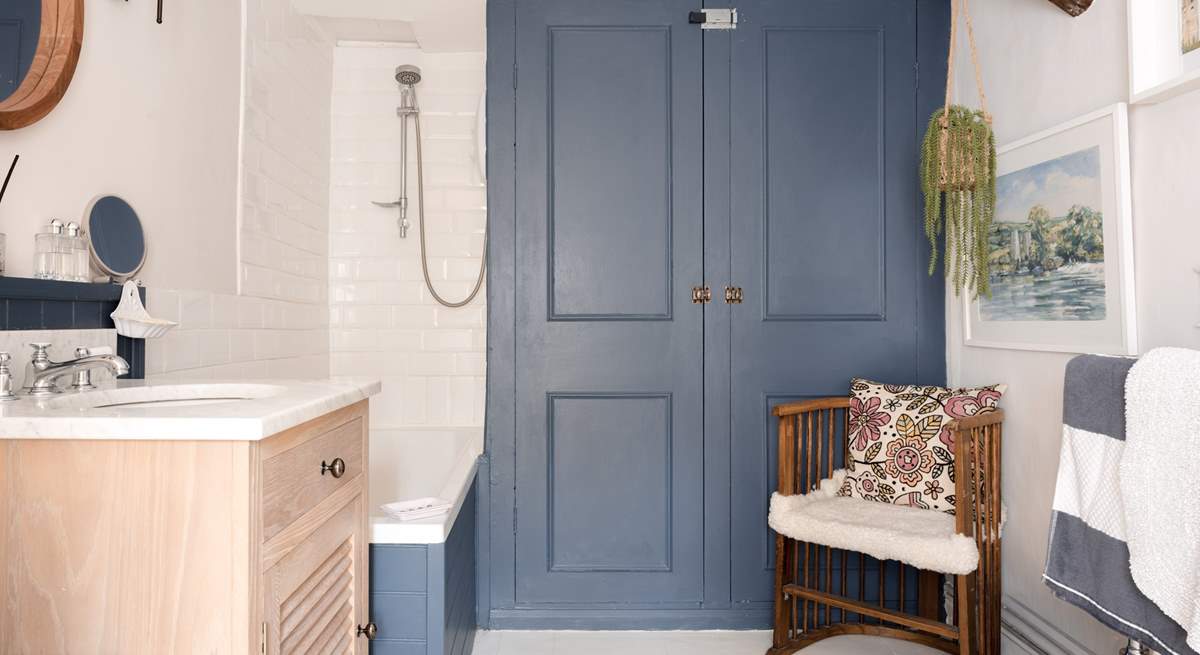 The extra large family bathroom showcases lots of natural light and  is perfect for a long soak or an energising blast in the shower.