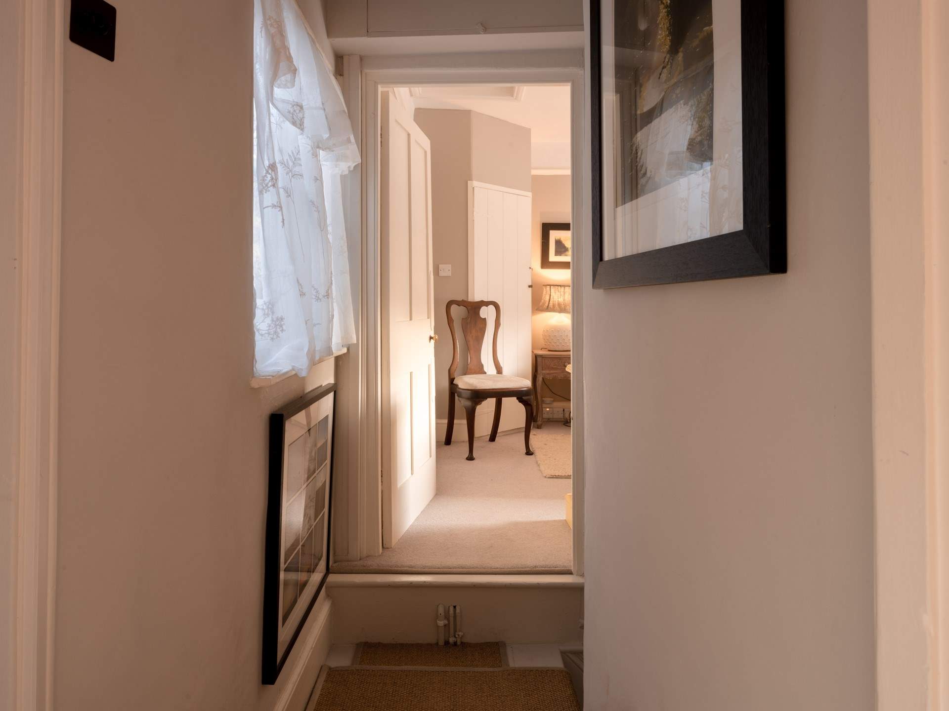 The bedrooms are either side of the staircase - just be mindful of the quirky step up.