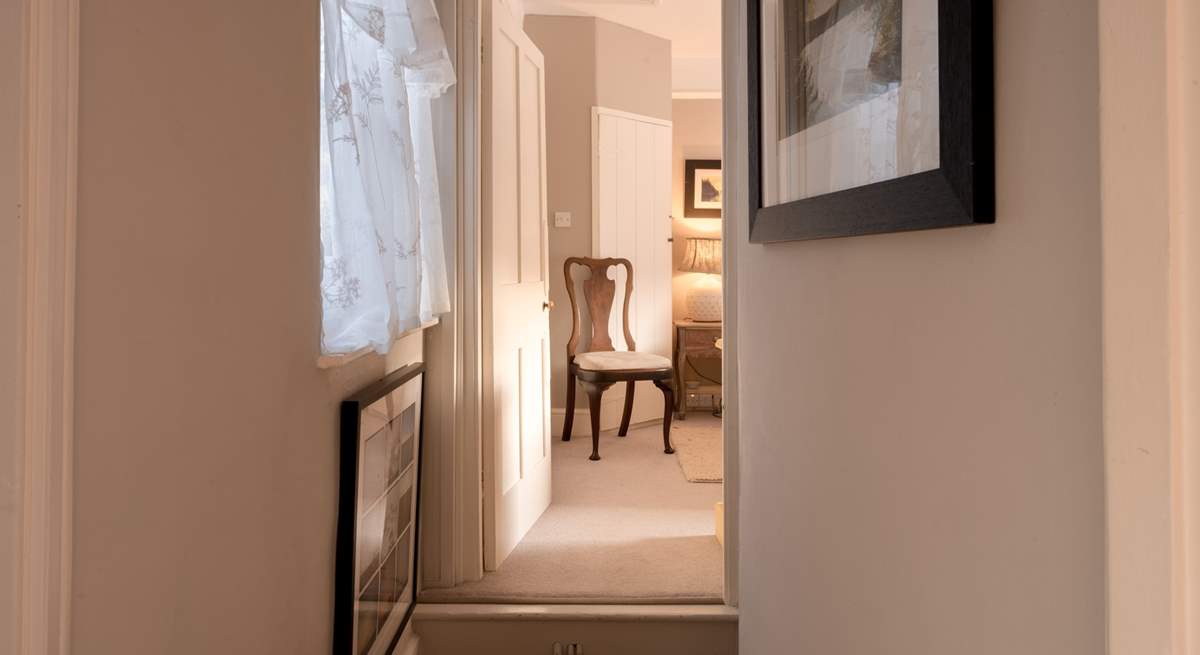 The bedrooms are either side of the staircase - just be mindful of the quirky step up.