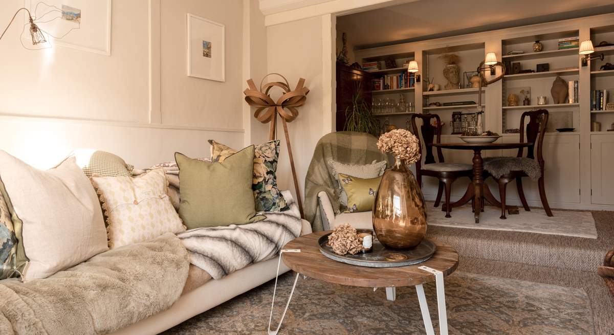 The sitting-room is a wonderful open and light space with plenty of room to put your feet up and relax.