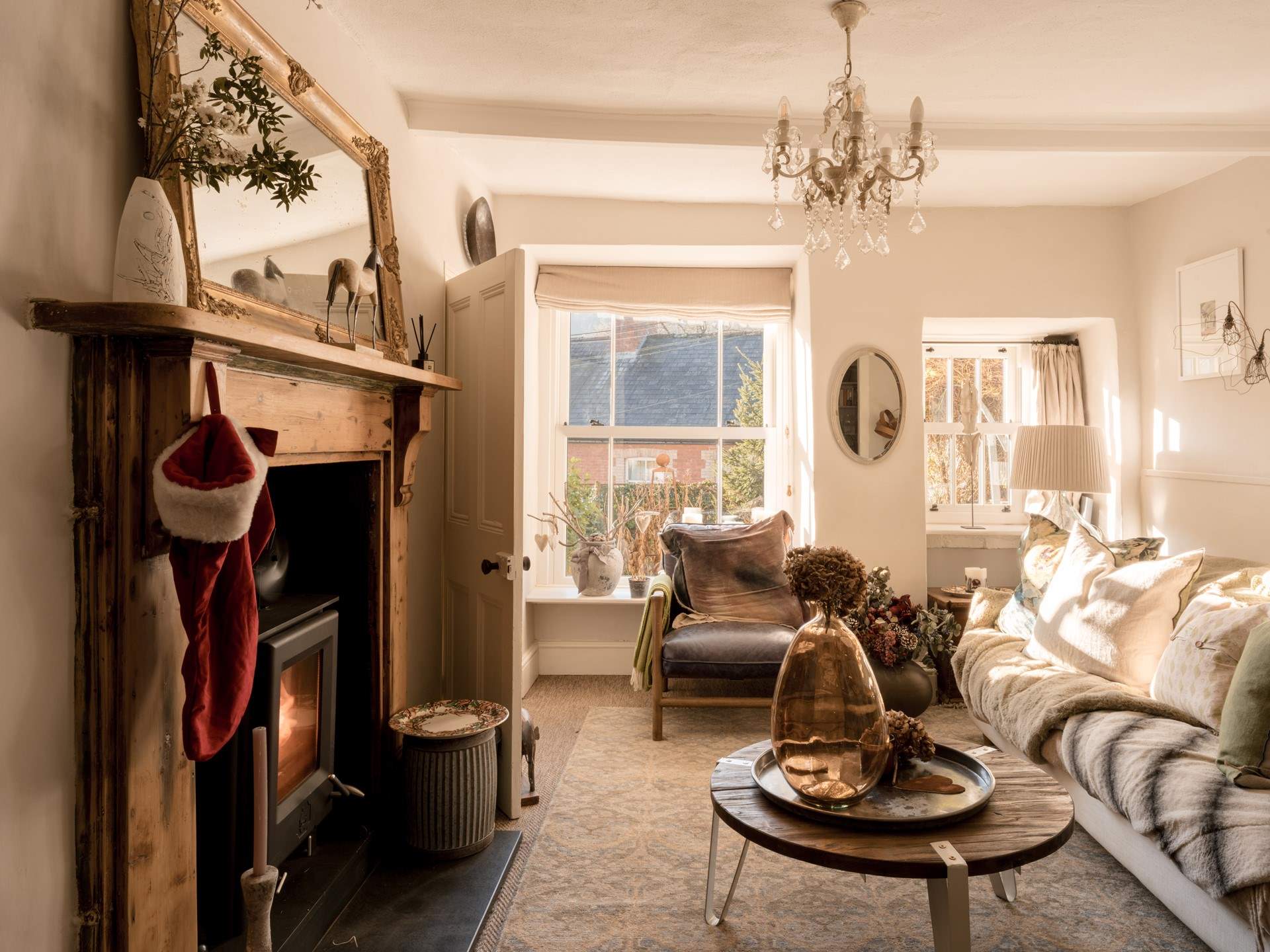 The sitting-room is a wonderful light space during the day and then the perfect cosy space with the wood-burner lit as the sun goes down.