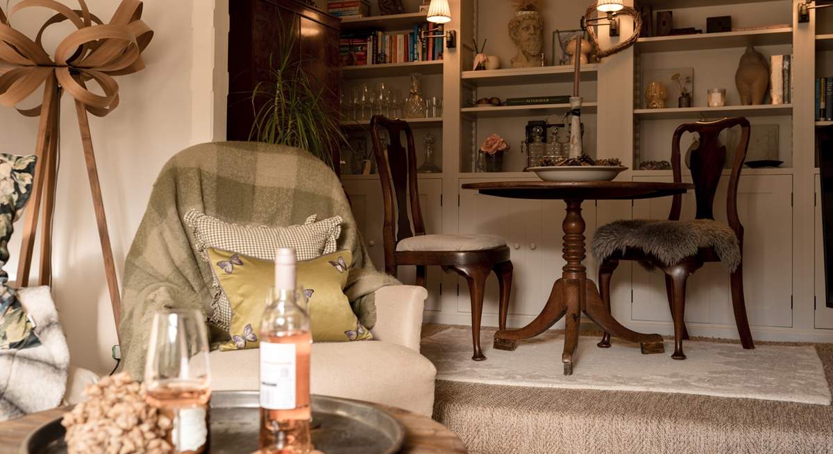 An intimate dining space is just off the sitting-room and offers comfortable seating for four (extra chairs provided).