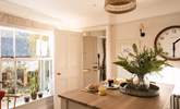 The kitchen is very light and airy, and enjoys a view out onto the front garden and patio. - Thumbnail Image