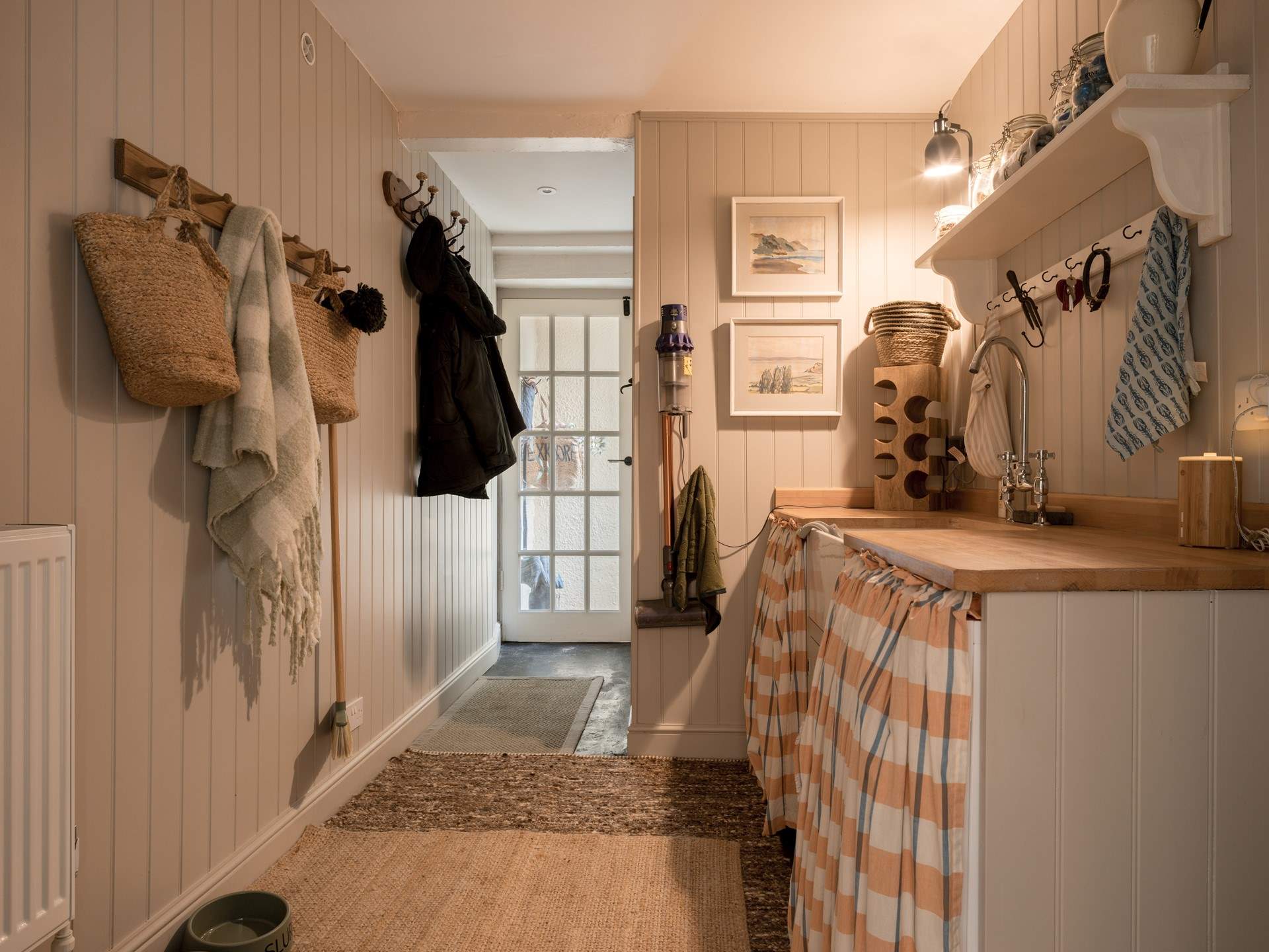 The all-important separate utility-room features a washing machine, tumble-drier and freezer.